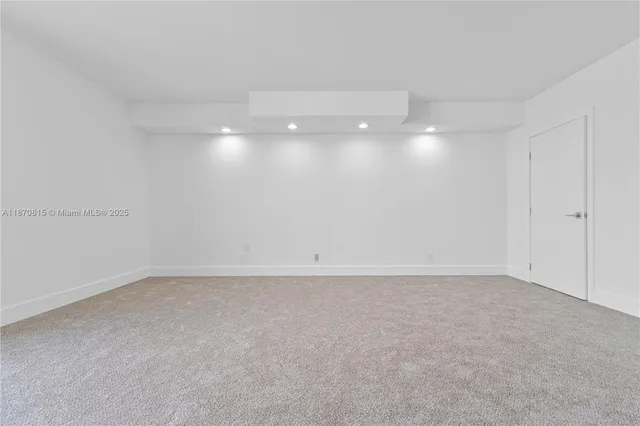 a view of an empty room with a balcony