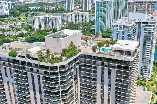 an aerial view of residential building and lake view