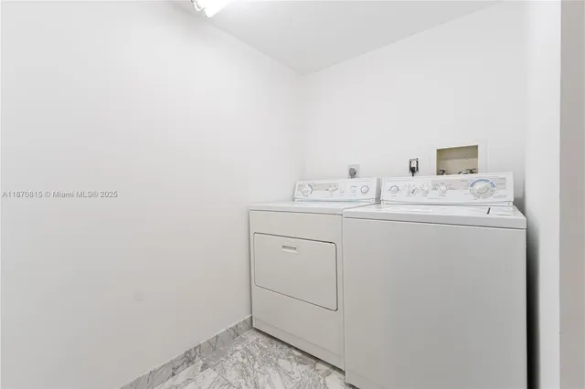 a large kitchen with stainless steel appliances lots of counter space and wooden floor