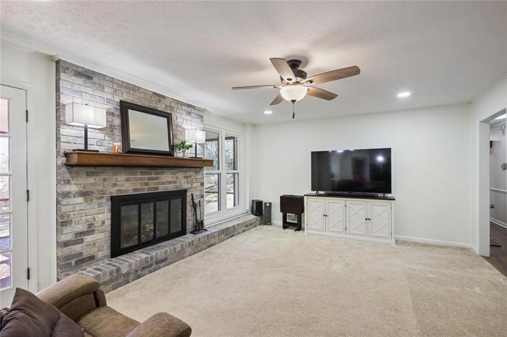 4505 Cochran Mill Road Fairburn, GA 30213 - Photo 8 of 36 a living room with furniture and a flat screen tv