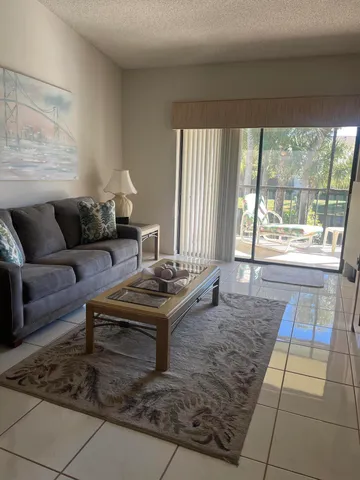 a living room with a couch and a large window