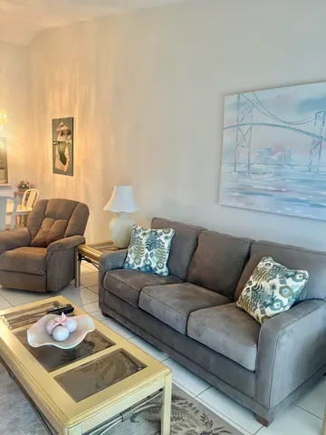 a living room with furniture and a couch