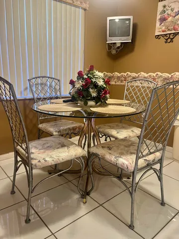 a dining room with furniture and wooden floor