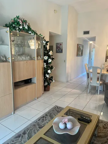 a kitchen with a table and a chair