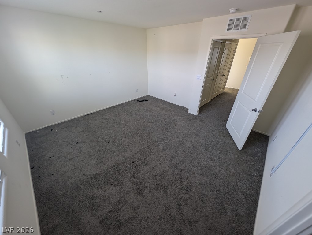 4820 Orchid Rdg Avenue Las Vegas, NV 89141 - Photo 8 of 16 A versatile space, this bedroom offers plush carpeting and a neutral palette for personalized decor.