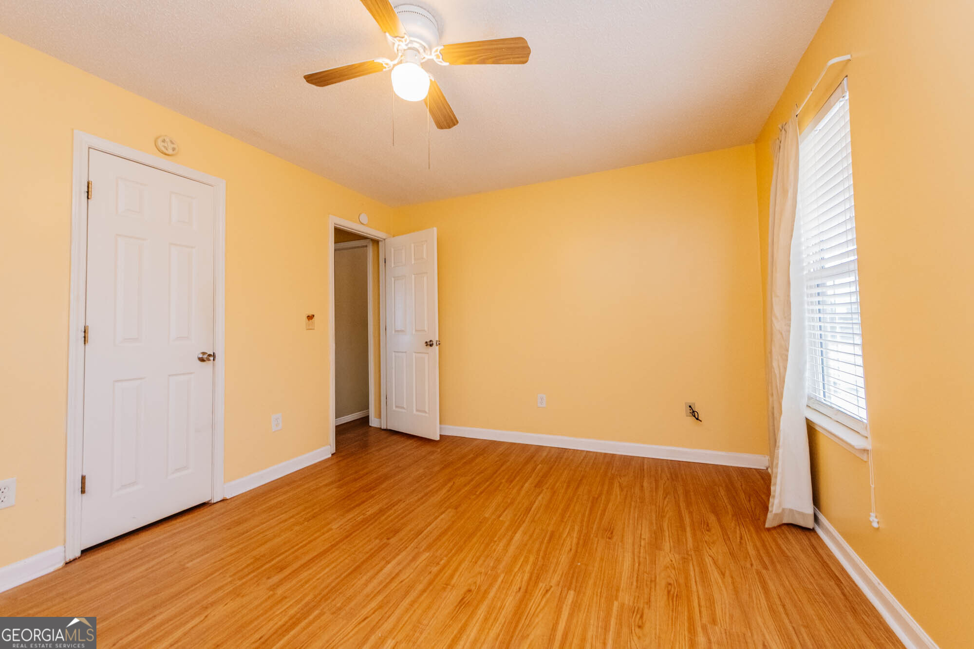 525 Hardison Church Road Byron, GA 31008 - Photo 14 of 32 a view of room with a ceiling fan and wooden floor