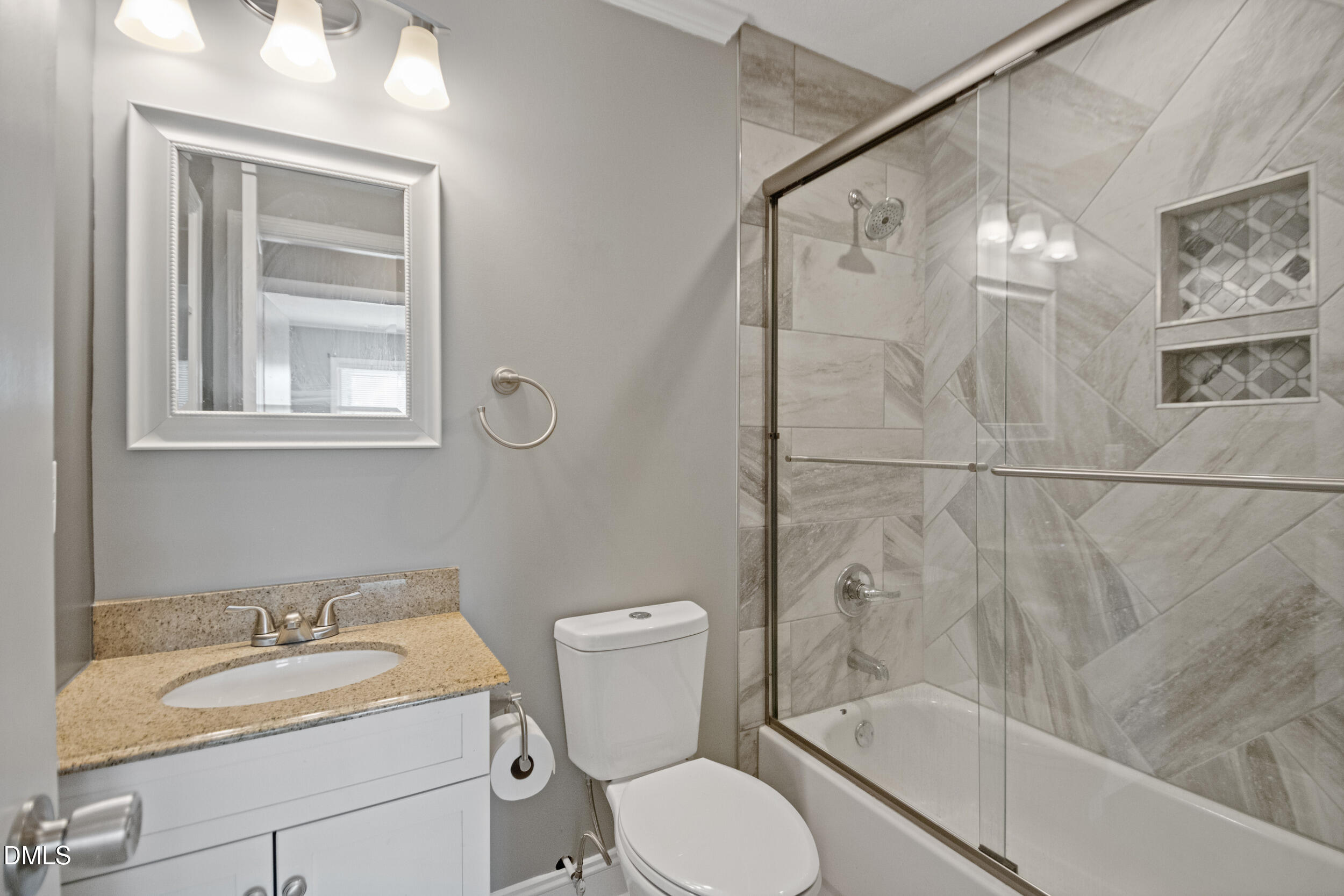 5909 Spinner Road Hope Mills, NC 28348 - Photo 16 of 24 a bathroom with a granite countertop sink toilet and shower