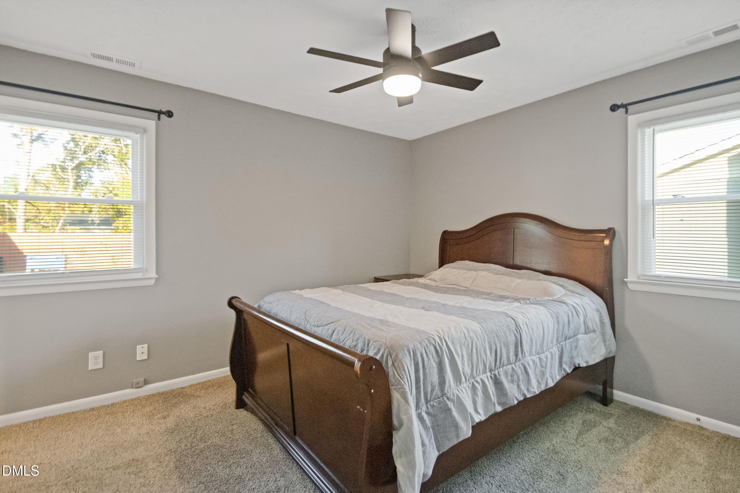 5909 Spinner Road Hope Mills, NC 28348 - Photo 17 of 24 a bedroom with a bed and a window
