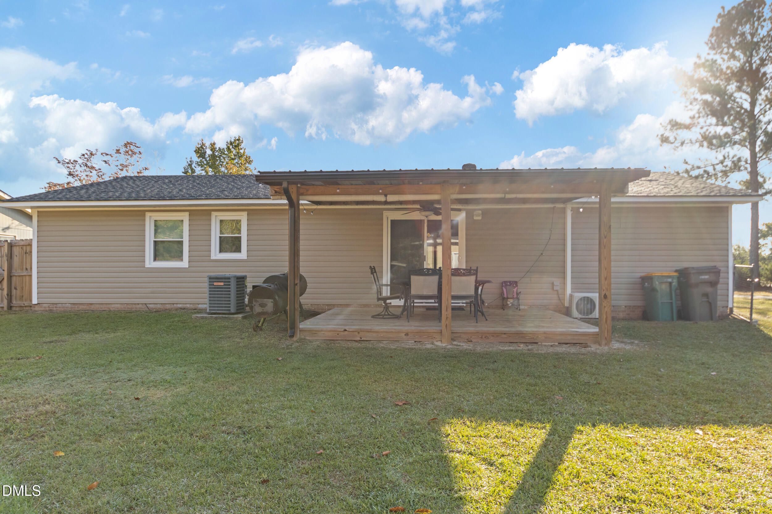 5909 Spinner Road Hope Mills, NC 28348 - Photo 22 of 24 a house view with swimming pool and wooden fence