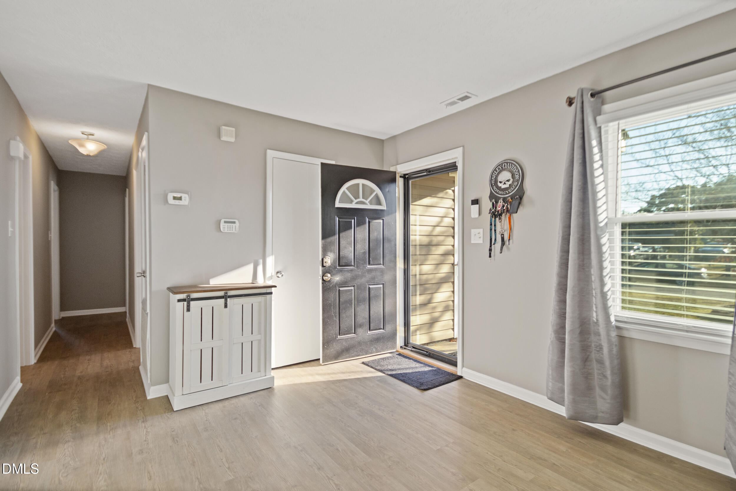 5909 Spinner Road Hope Mills, NC 28348 - Photo 5 of 24 a view of entryway with livingroom