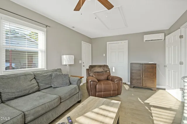 a living room with furniture and a window