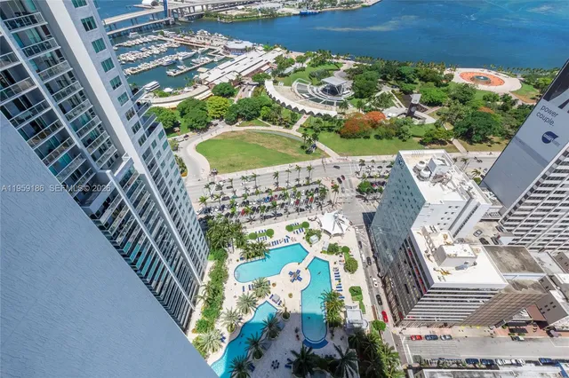 a white bench sitting in front of a building