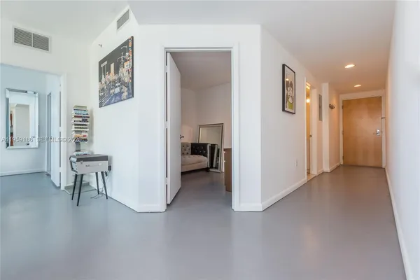 a view of a livingroom with furniture and a window
