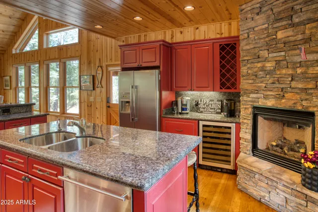 a bathroom with a sink a toilet and shower curtain