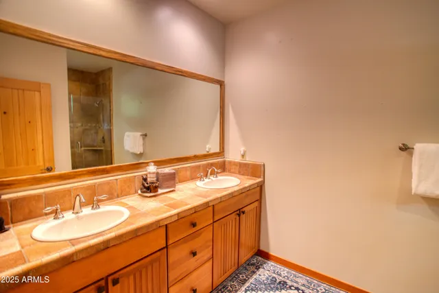 a bedroom with furniture and a flat screen tv