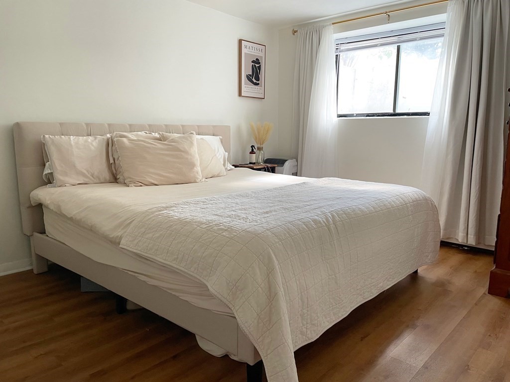 34 Kinross Road, Unit 2 Boston, MA 02135 - Photo 6 of 6 a bedroom with a bed and a window