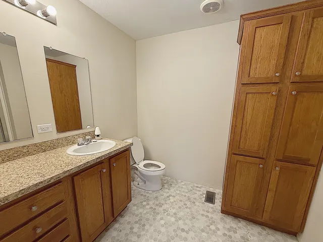 a utility room with cabinets washer and dryer