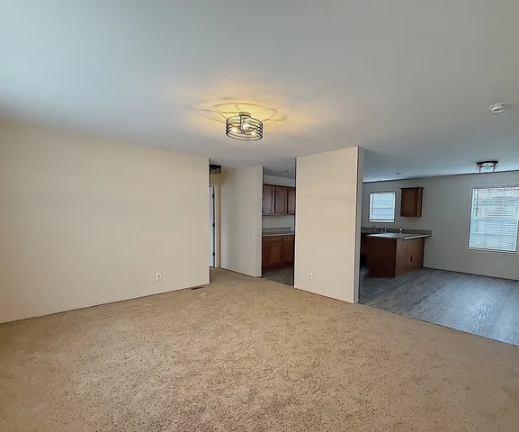 a kitchen with kitchen island a sink stainless steel appliances and cabinets