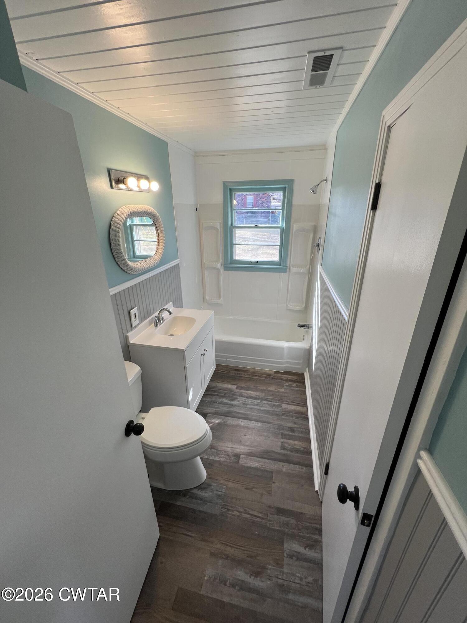 2094 Old Stage Road Adamsville, TN 38310 - Photo 11 of 12 a bathroom with a sink a toilet and a mirror