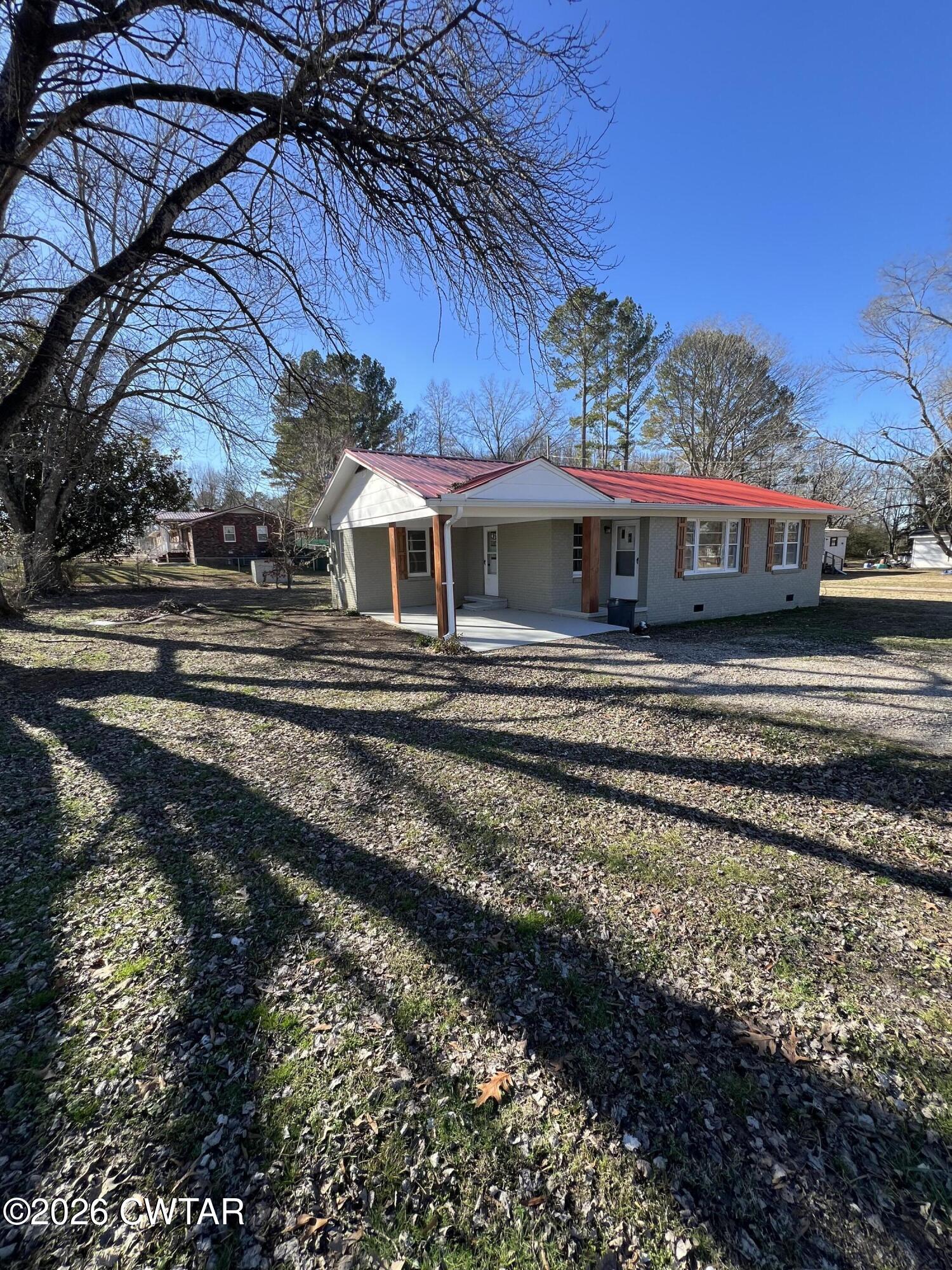 2094 Old Stage Road Adamsville, TN 38310 - Photo 2 of 12 a view of a back yard of the house