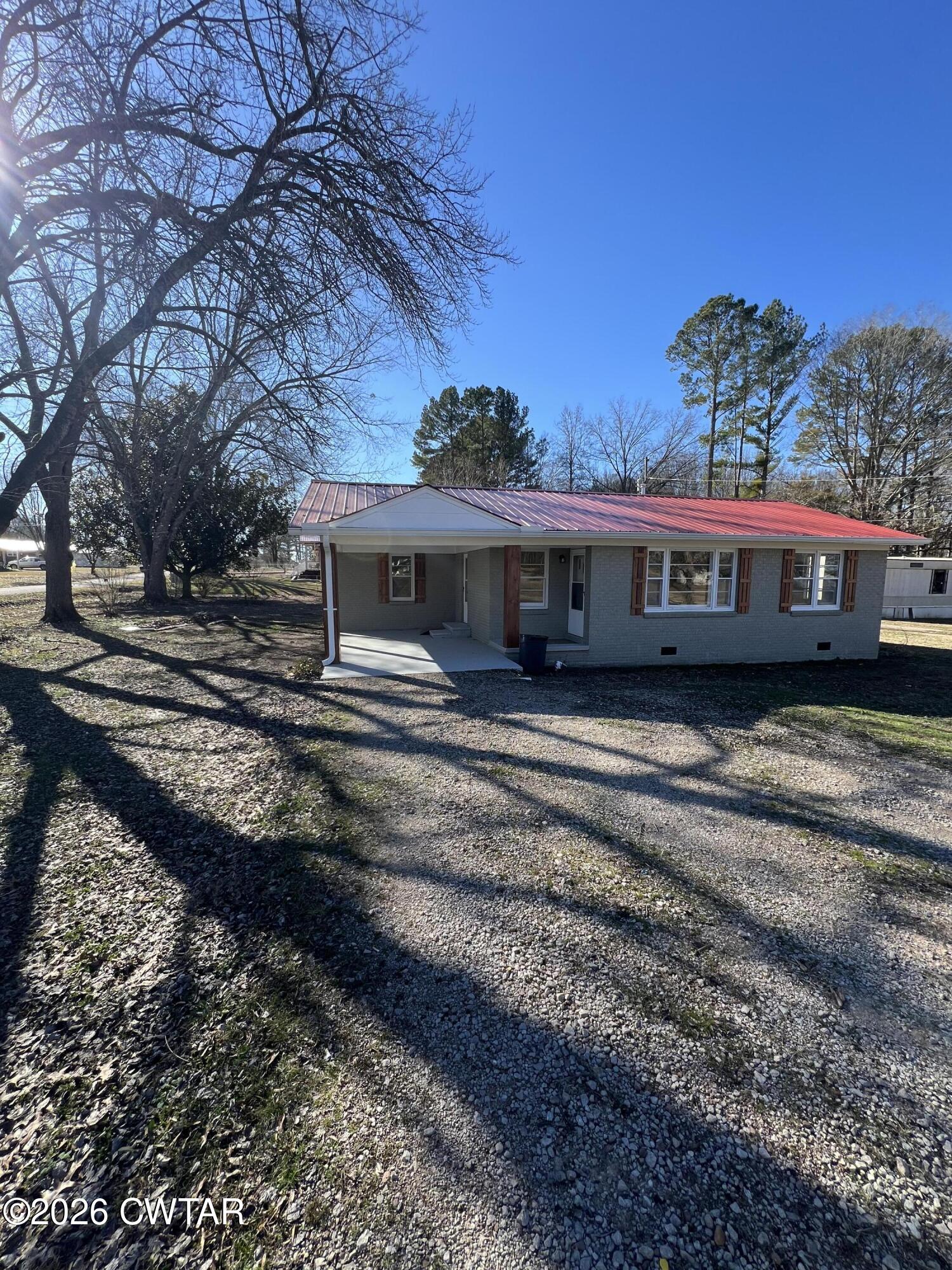 2094 Old Stage Road Adamsville, TN 38310 - Photo 3 of 12 a view of a house with a yard