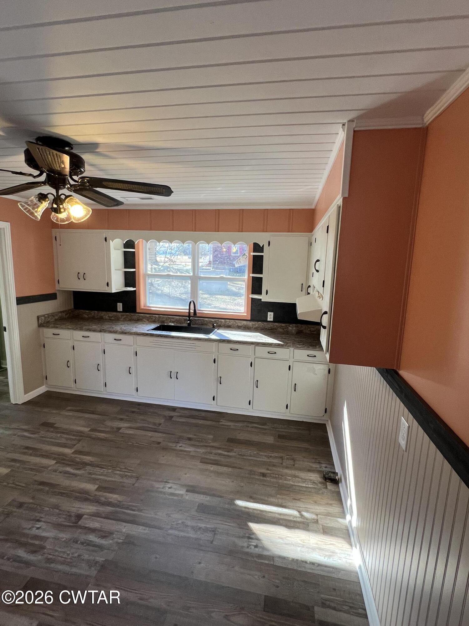 2094 Old Stage Road Adamsville, TN 38310 - Photo 6 of 12 a view of a kitchen with a sink and cabinets