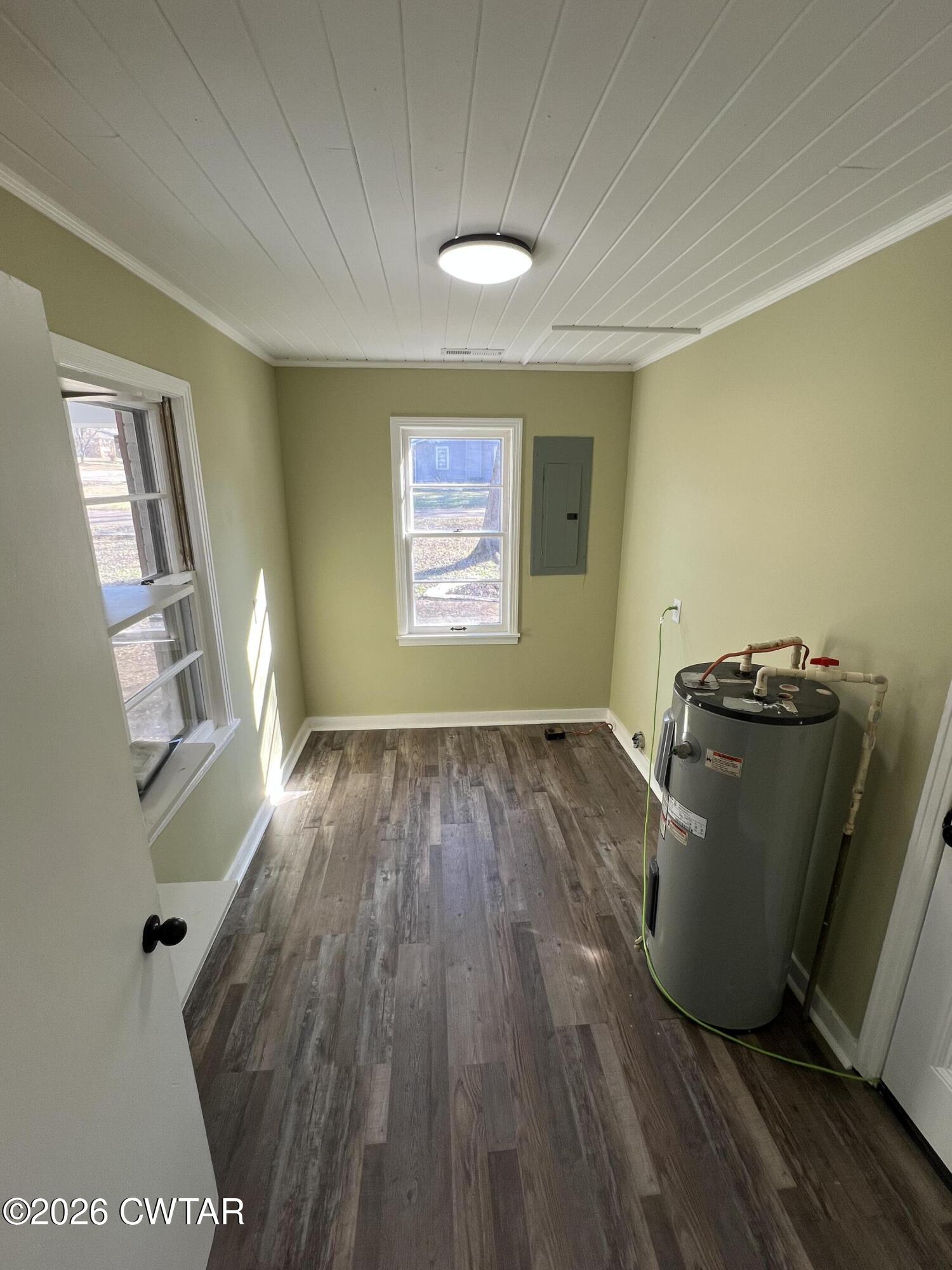 2094 Old Stage Road Adamsville, TN 38310 - Photo 9 of 12 a view of a room with wooden floor and a window