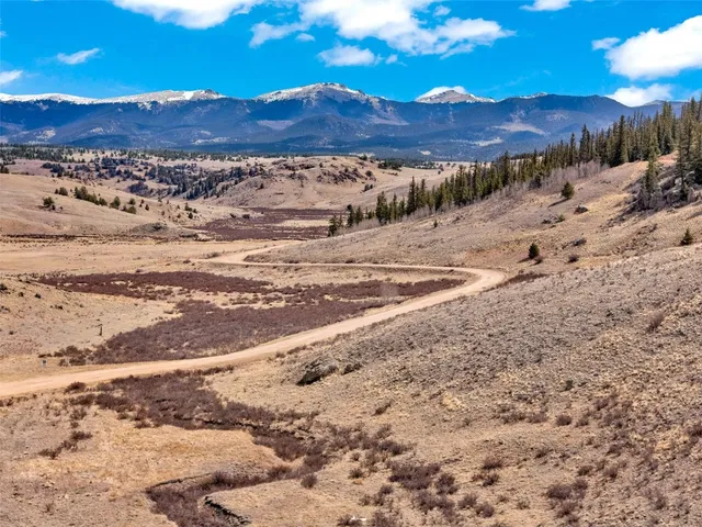 a view of mountains and sunset