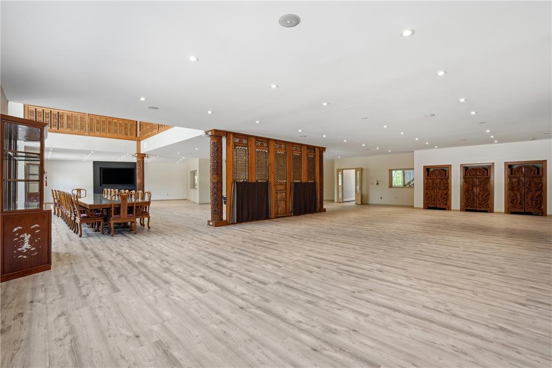 6271 Batman Road Zionsville, PA 18092 - Photo 6 of 100 An open-concept great room showcases abundant recessed lighting, high ceilings, and unique carved wood accents.