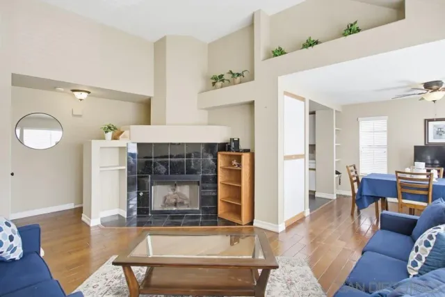 a living room with furniture and a fireplace