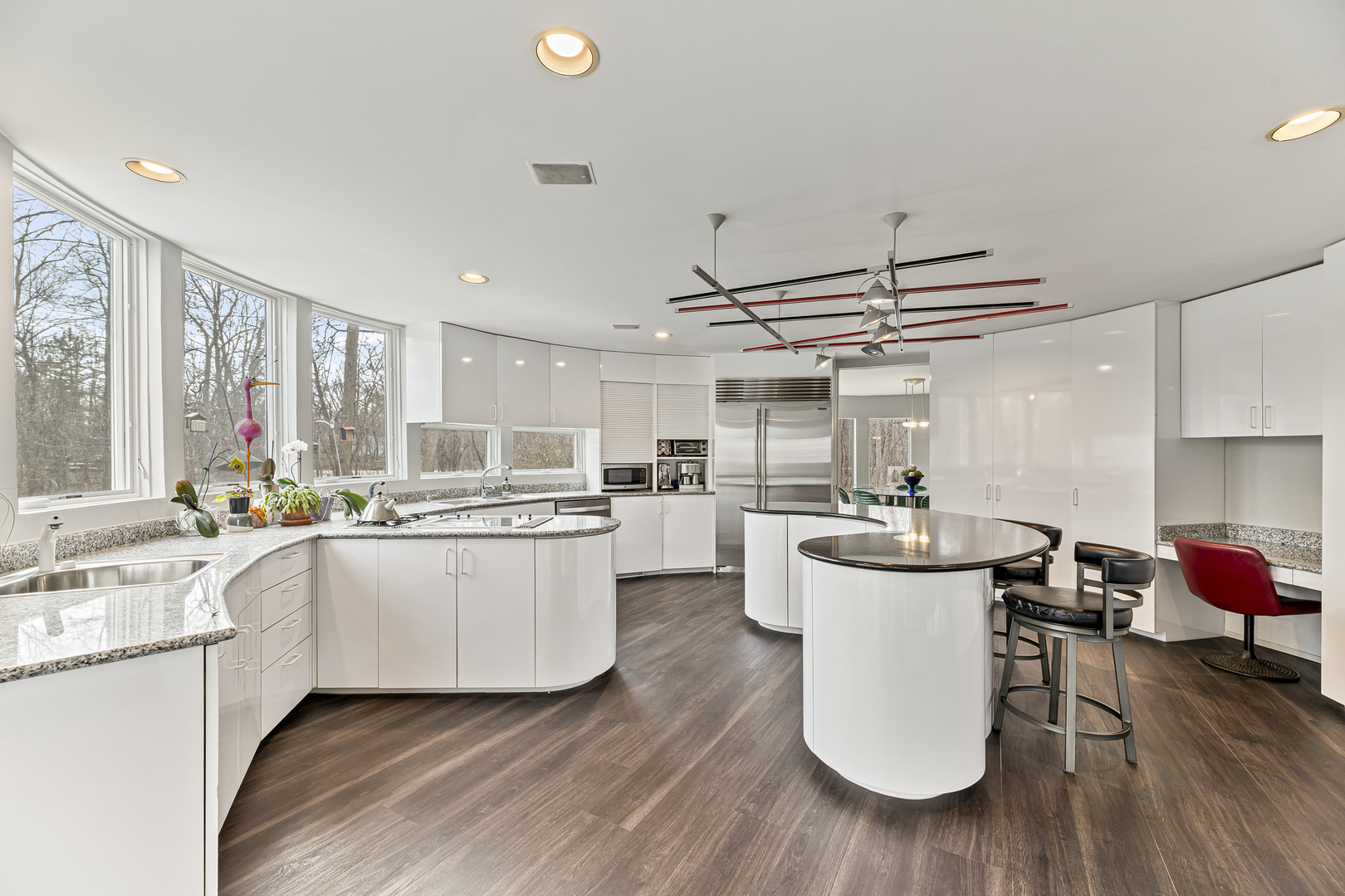 4 Dunsinane Lane Bannockburn, IL 60015 - Photo 12 of 40 a kitchen with sink cabinets and wooden floor