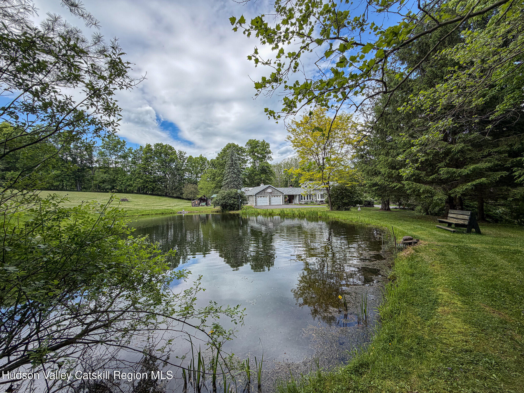 221 Camp Medusa Road Rensselaerville, NY 12120 - Photo 34 of 57 a body of water with a tree in the background