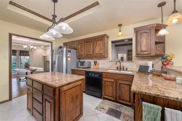 a kitchen with a table and chairs in it
