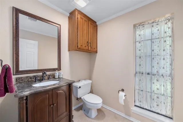 a bedroom with bed and a chandelier