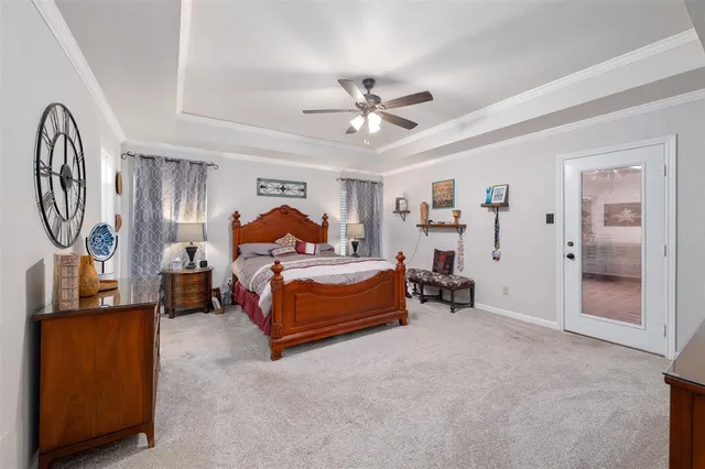 a spacious en suite bathroom with a double vanity sink and a mirror