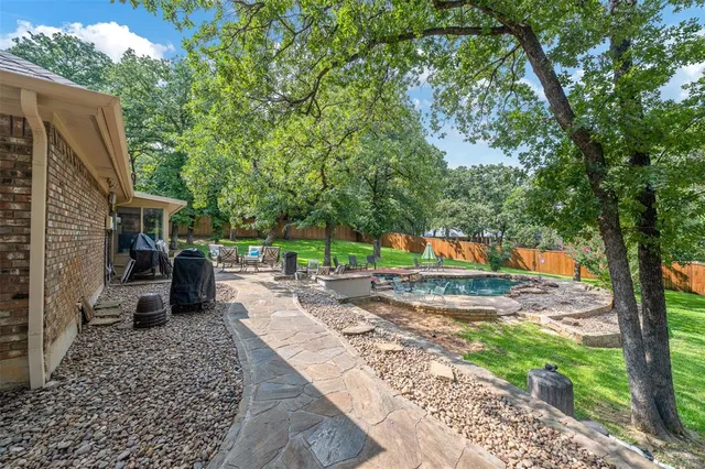a view of a patio with furniture and a fire pit