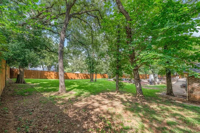 a view of a house with a big yard
