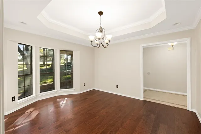 a view of livingroom with window and wooden floor