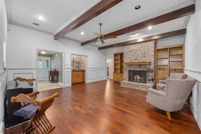 a bathroom with a granite countertop sink and a white cabinets