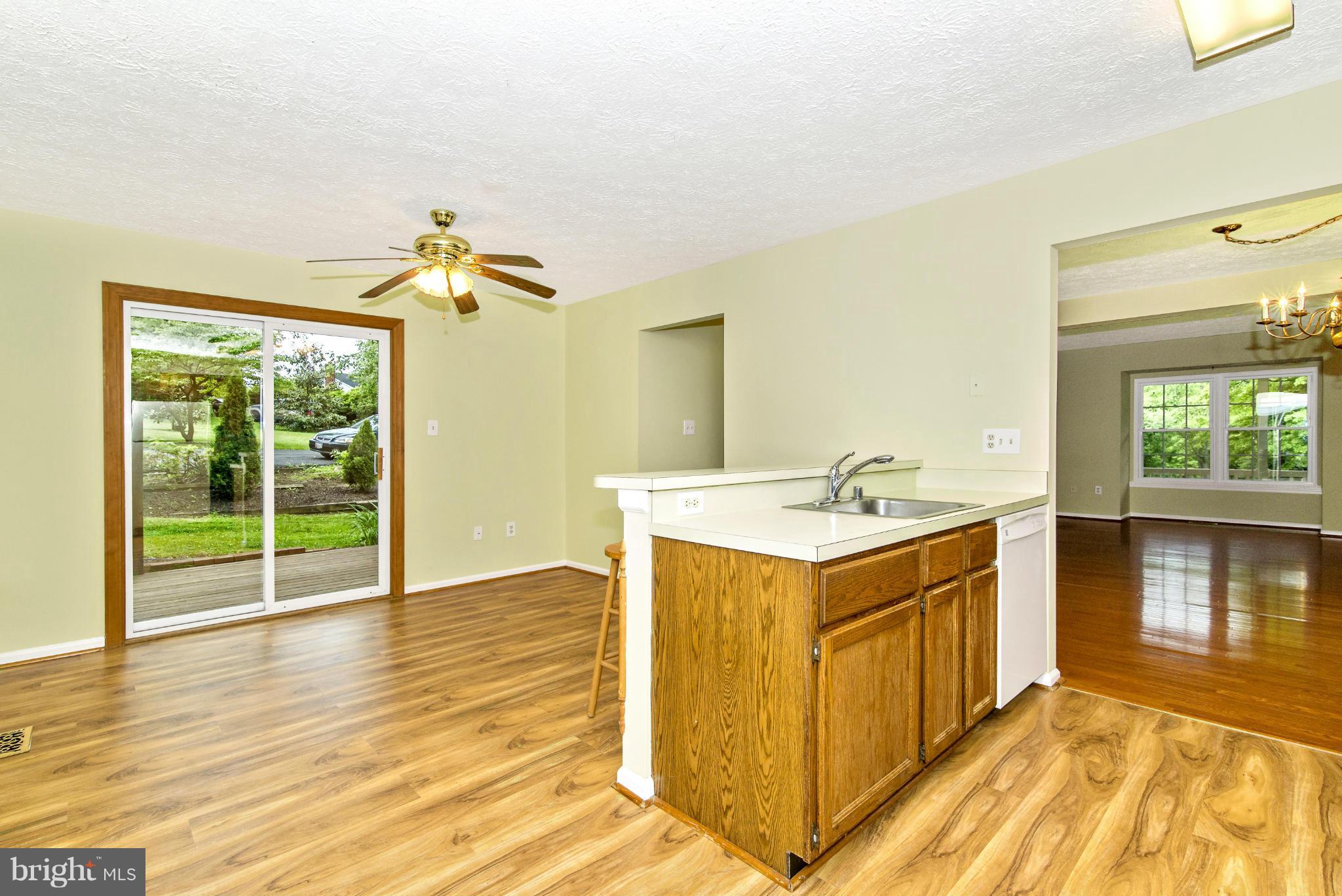 1709 Brookshire Run Point of Rocks, MD 21777 - Photo 13 of 24 a view of a kitchen with a sink and dishwasher with wooden floor
