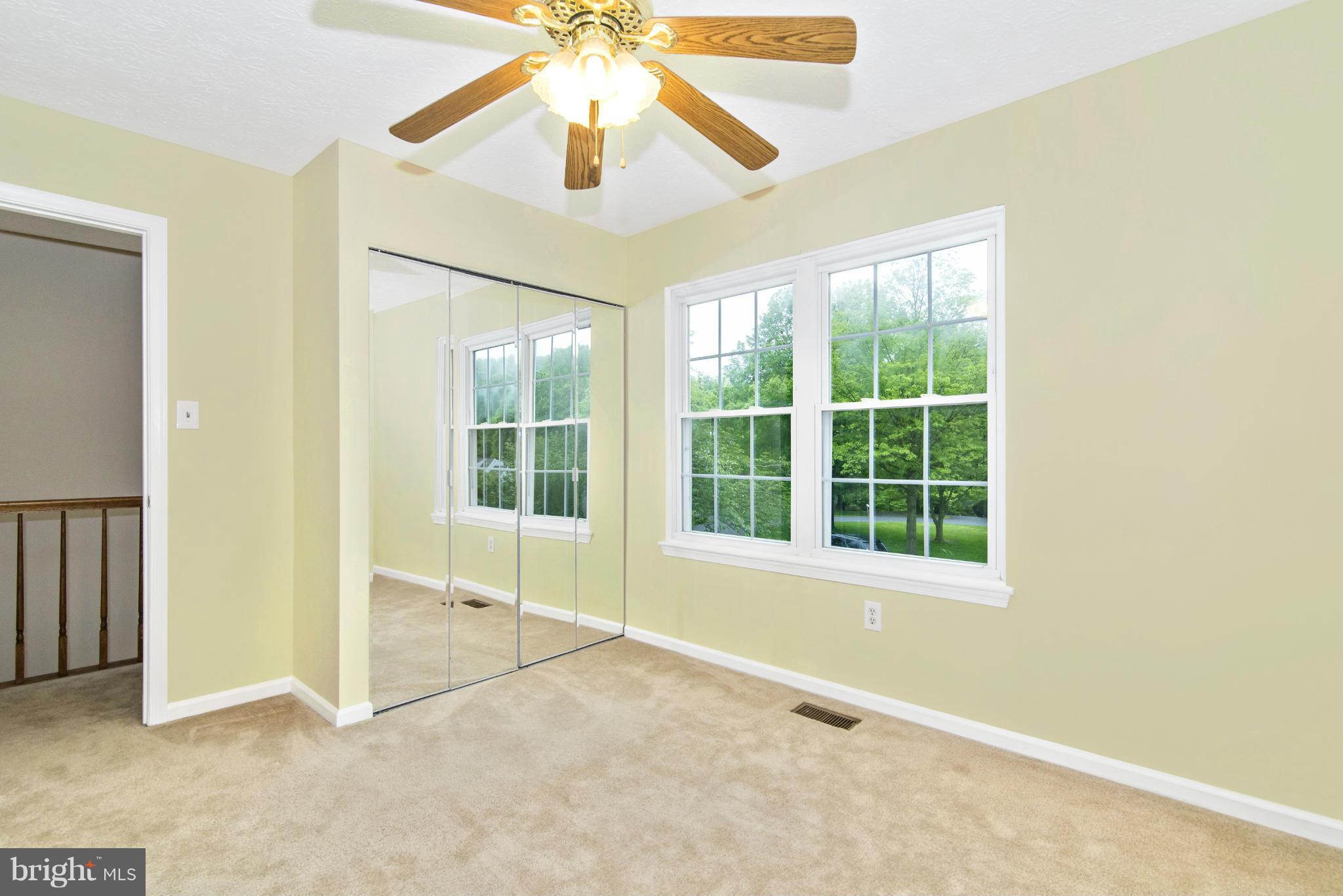 1709 Brookshire Run Point of Rocks, MD 21777 - Photo 23 of 24 an empty room with windows and fan