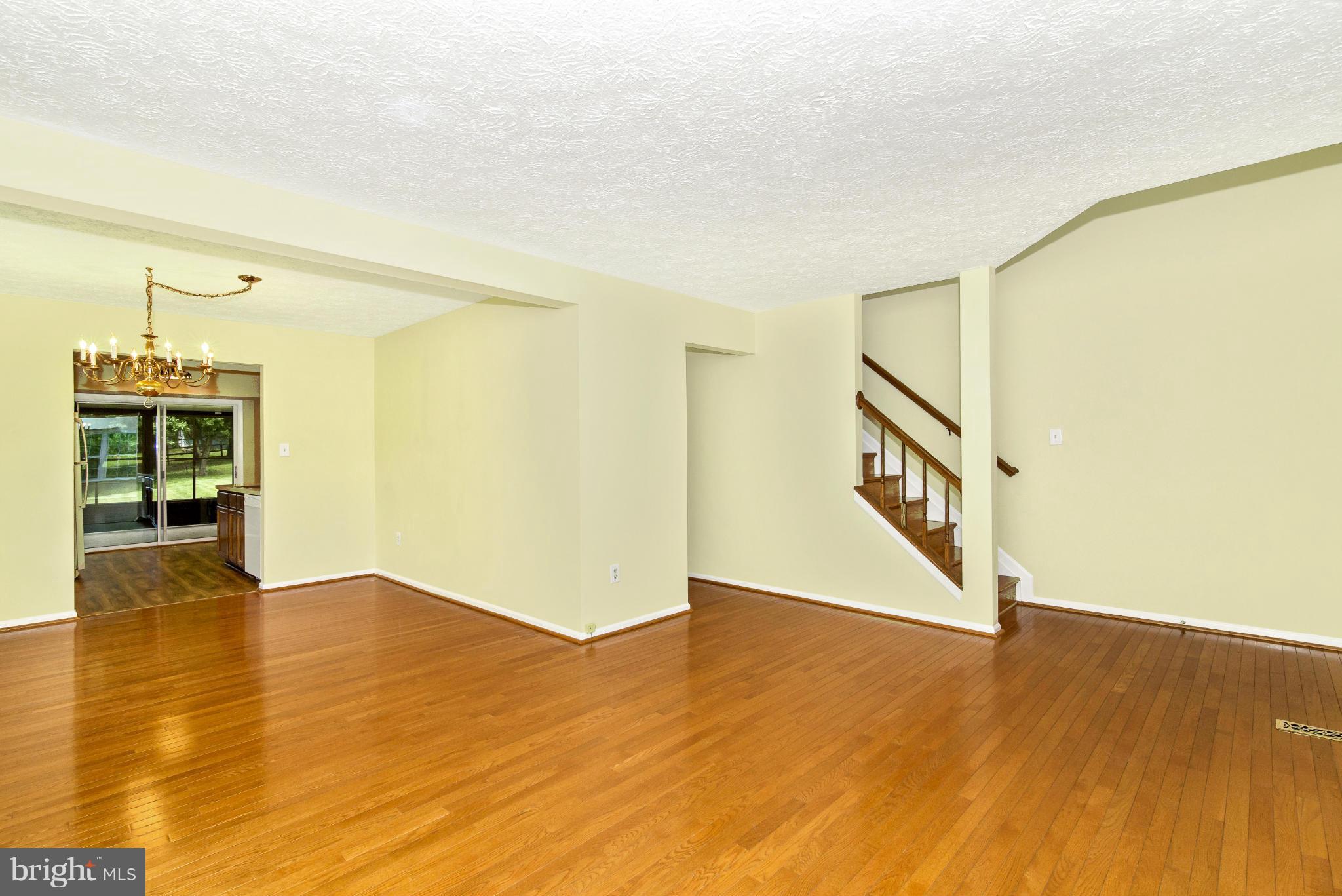 1709 Brookshire Run Point of Rocks, MD 21777 - Photo 9 of 24 a view of an empty room with wooden floor