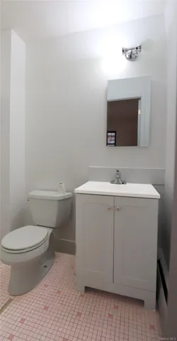 a kitchen with stainless steel appliances granite countertop a refrigerator a stove and a sink