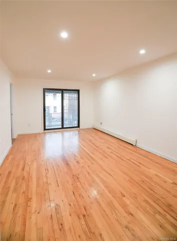 a large kitchen with stainless steel appliances granite countertop a refrigerator and a stove top oven