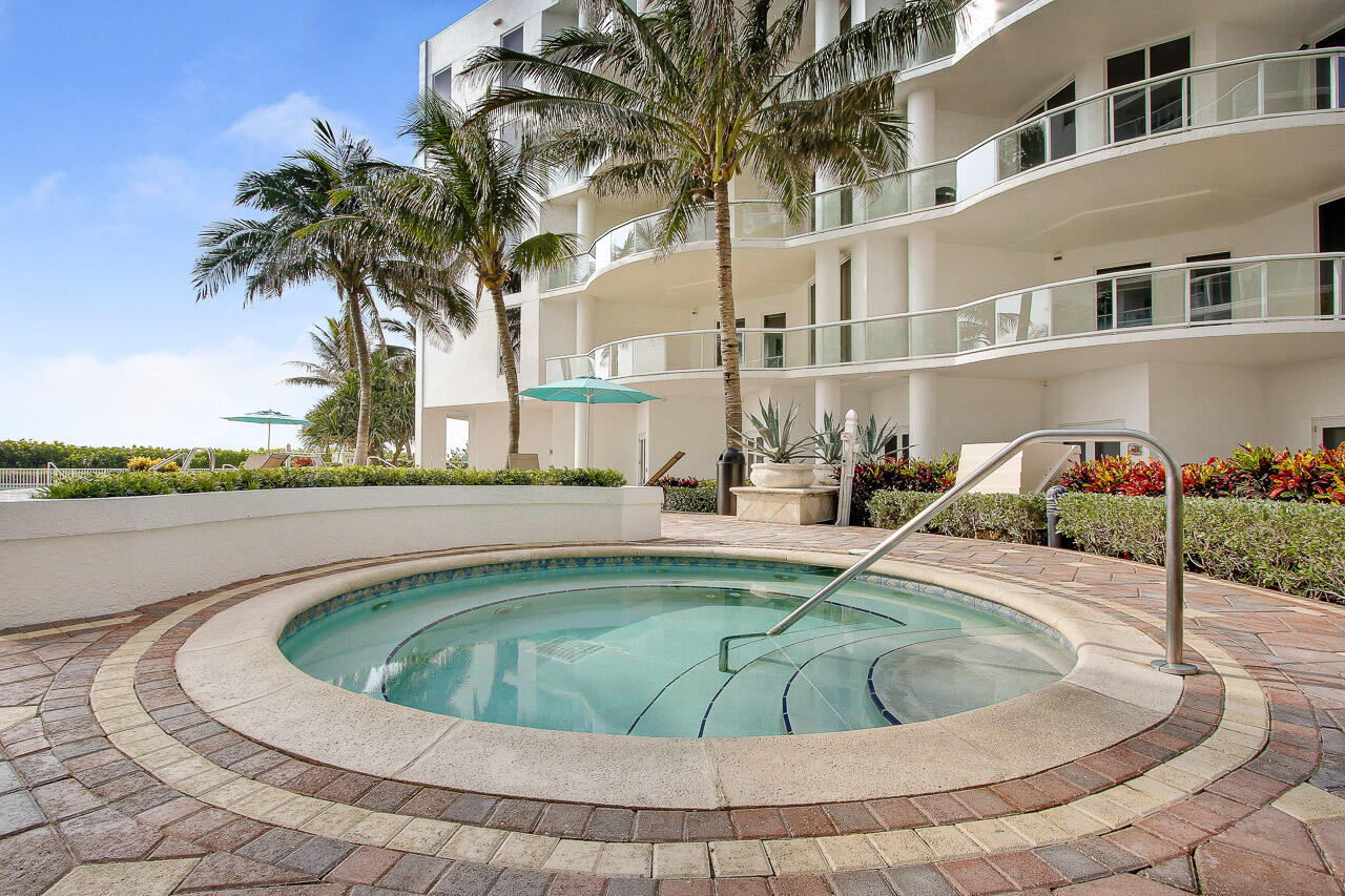 4600 North Ocean Drive, Unit 1903 Singer Island, FL 33404 - Photo 30 of 49 a view of a swimming pool with a garden