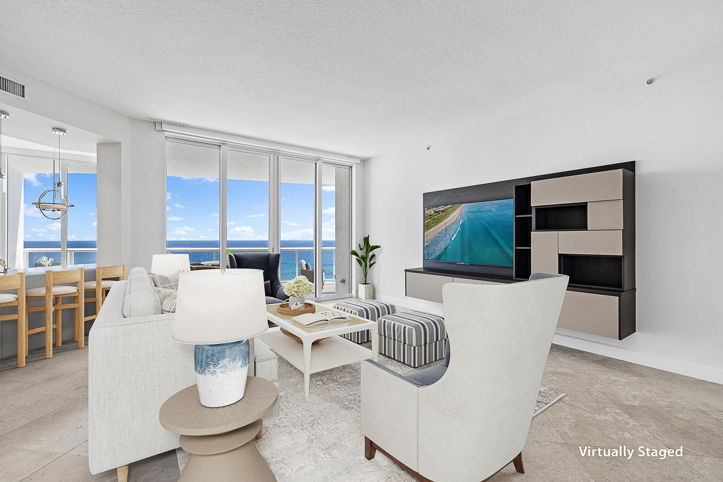 4600 North Ocean Drive, Unit 1903 Singer Island, FL 33404 - Photo 3 of 49 a living room with furniture a flat screen tv and a large window