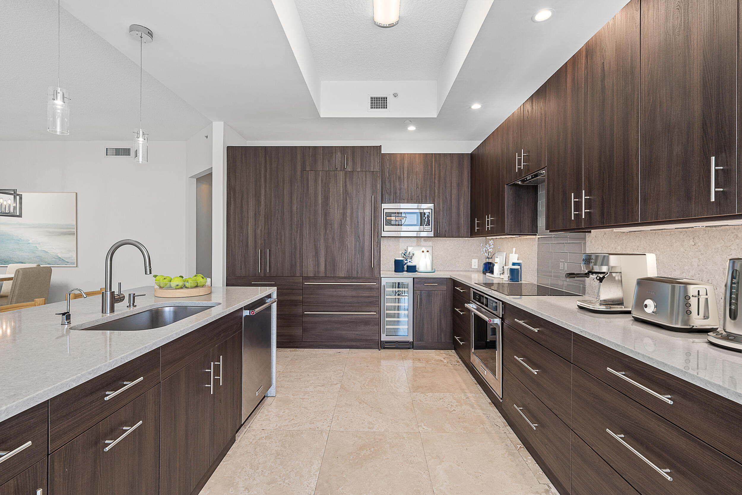 4600 North Ocean Drive, Unit 1903 Singer Island, FL 33404 - Photo 4 of 49 a kitchen with stainless steel appliances a sink stove top oven and cabinets