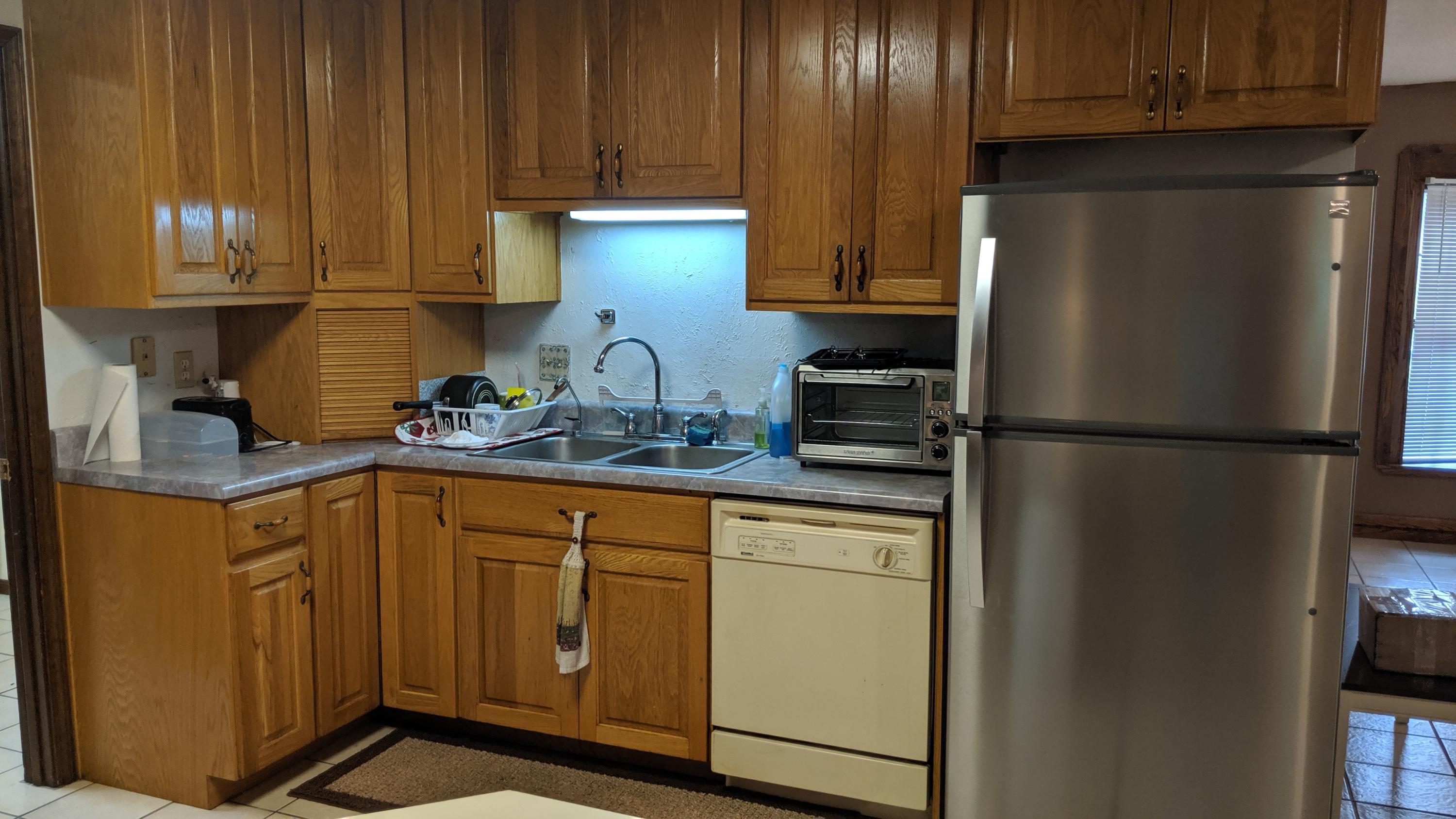 602 Valley Road Crestview, FL 32539 - Photo 11 of 34 a kitchen with stainless steel appliances granite countertop a refrigerator and a sink