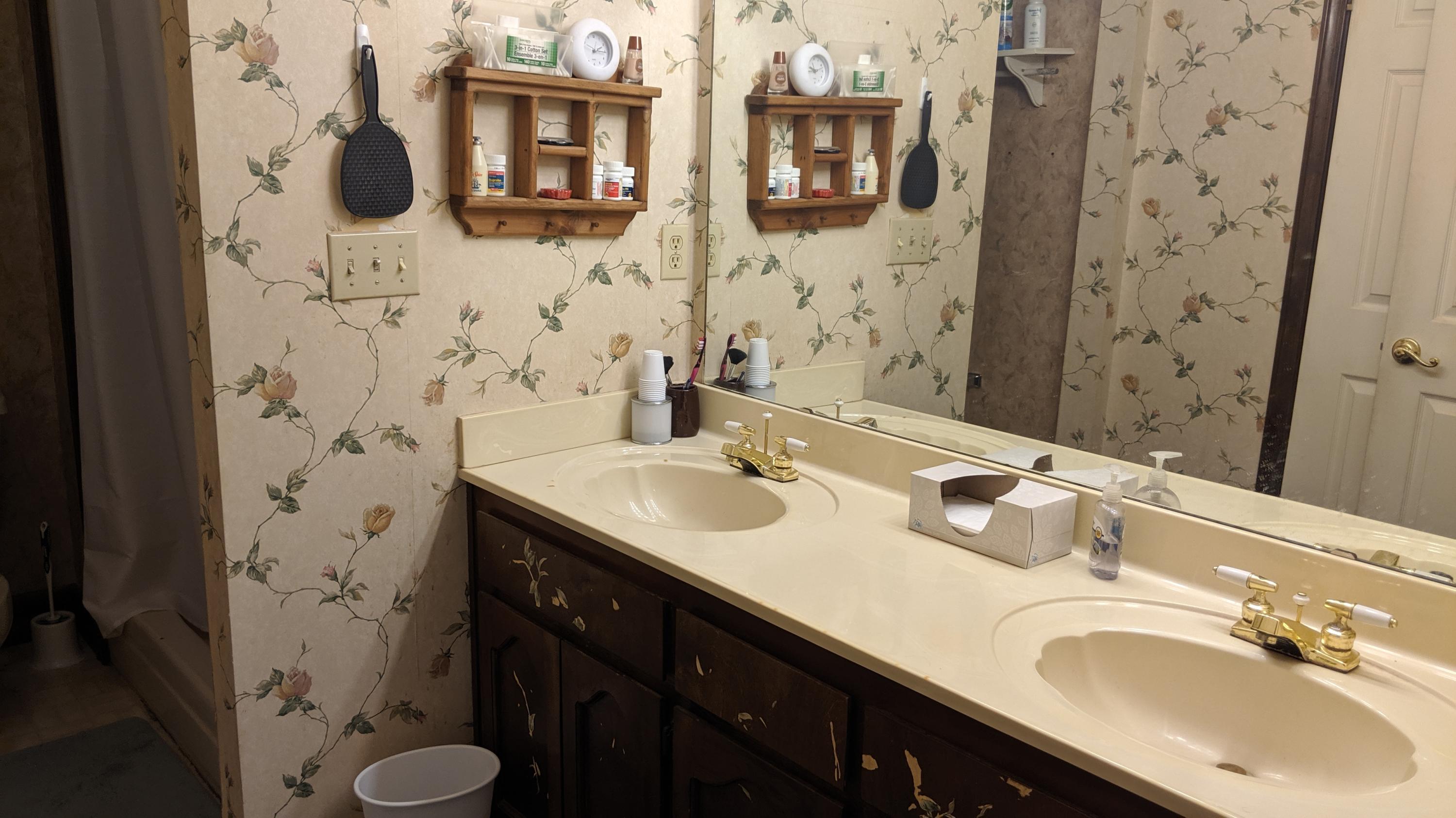 602 Valley Road Crestview, FL 32539 - Photo 20 of 34 a bathroom with a granite countertop sink and a mirror