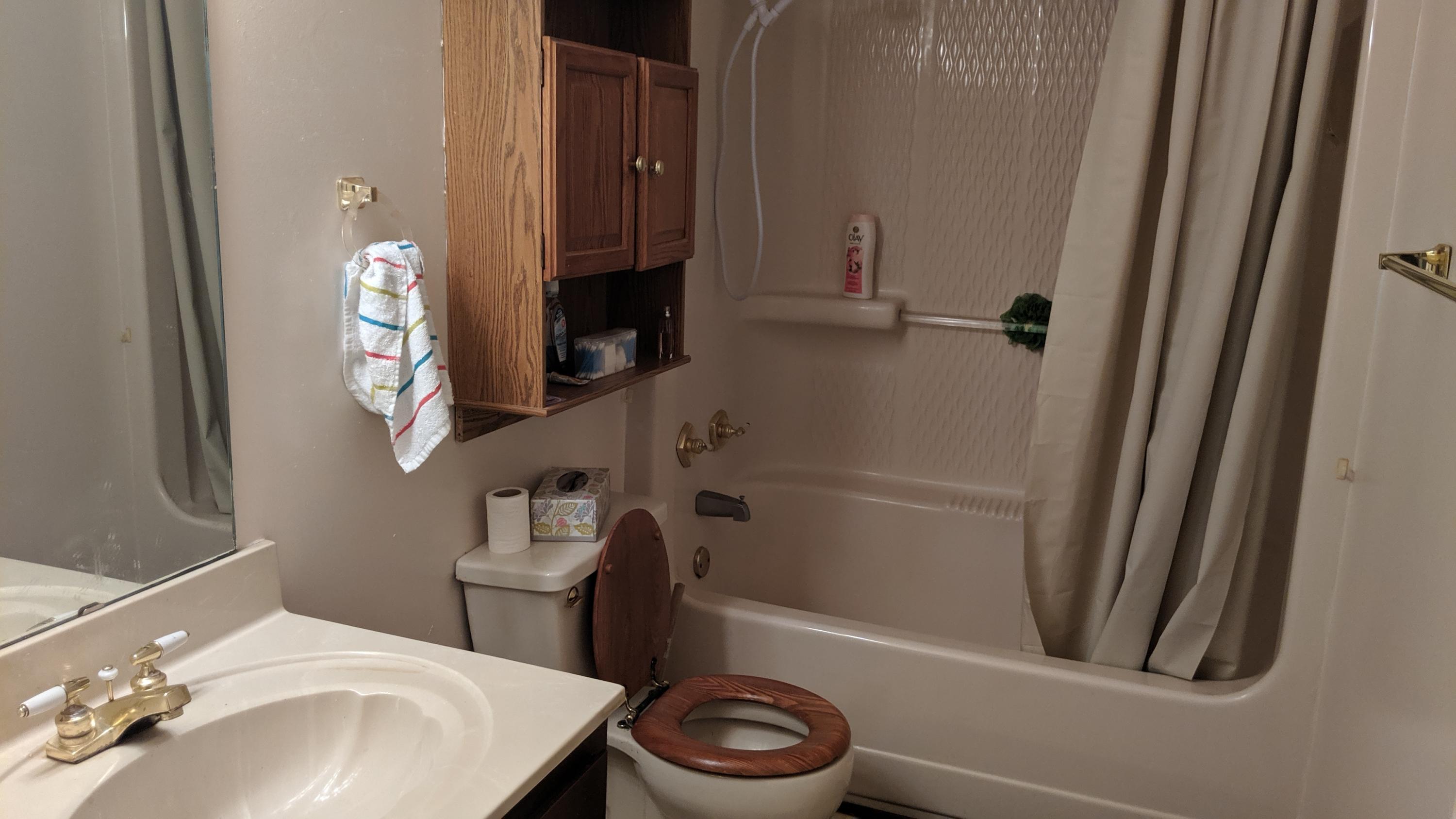 602 Valley Road Crestview, FL 32539 - Photo 22 of 34 a bathroom with a sink a toilet and shower